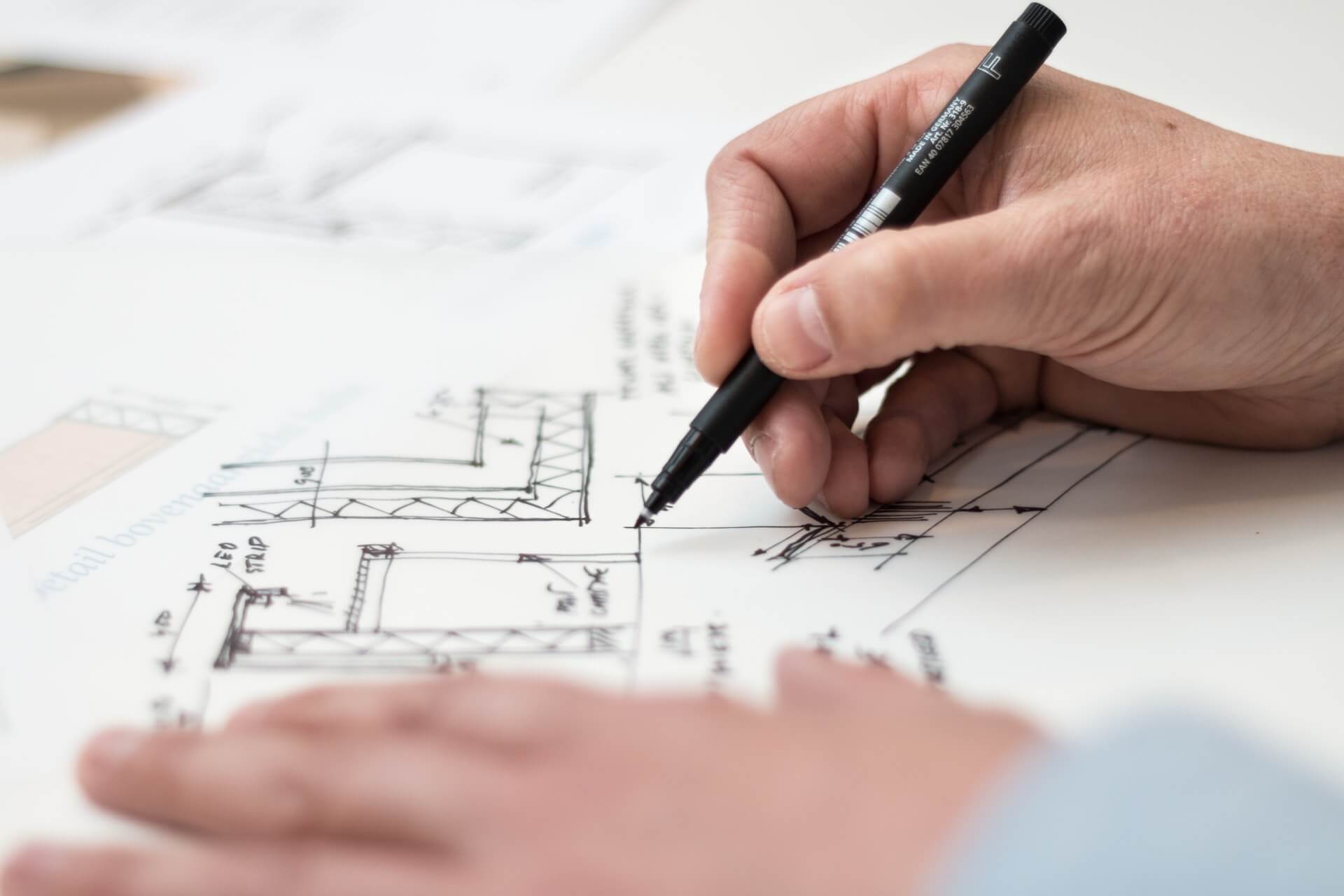 person working on floor plans